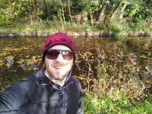 Craig running near a river