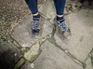 Running shoes covered in Mud