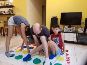 family playing Twister